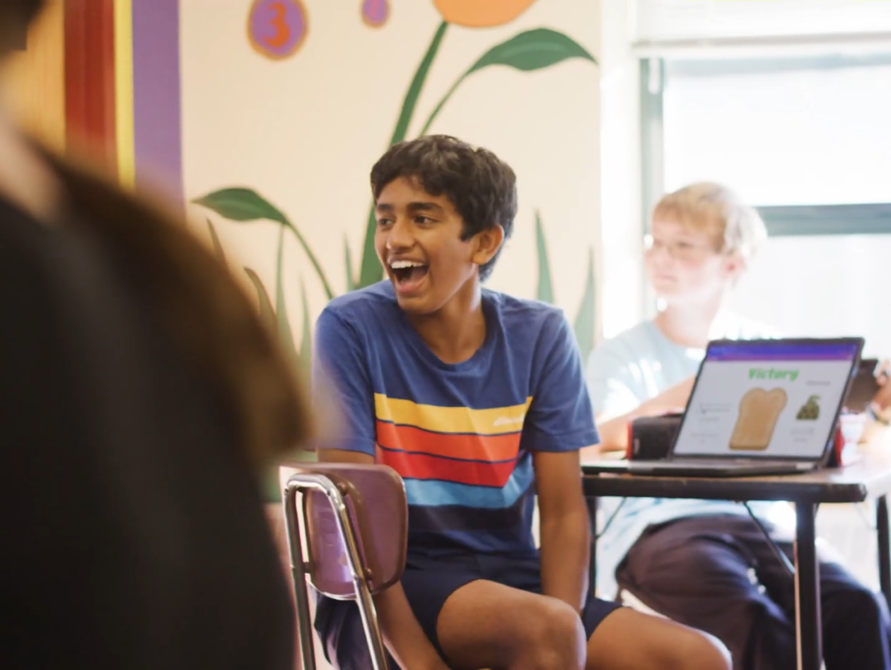 Private Middle School Manchester New Hampshire | Private Schools Near Me | Student Laughing at Desk